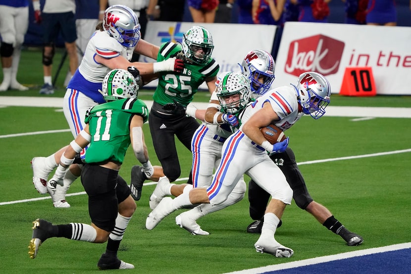 Austin Westlake running back Grey Nakfoor (22) scores on a touchdown run past Southlake...