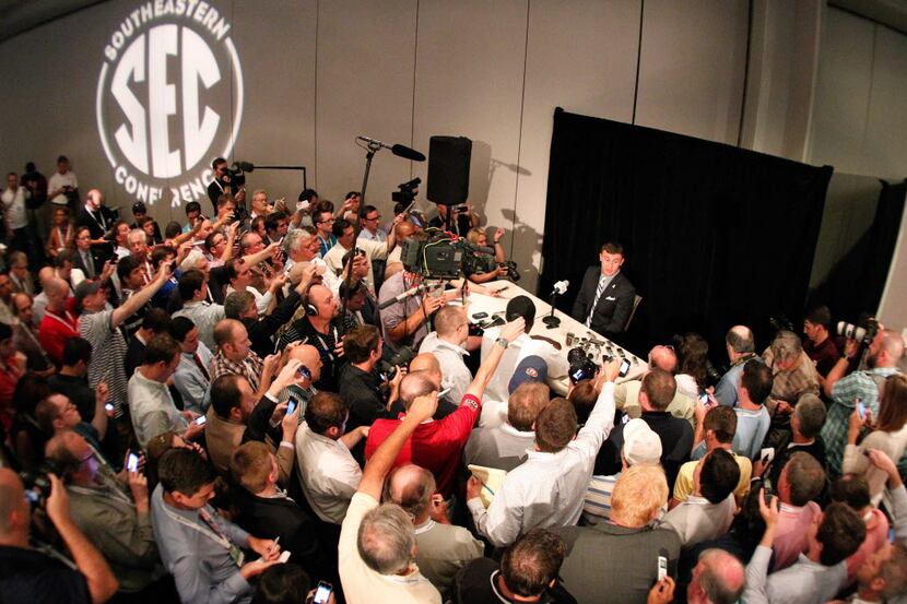 Texas A&M Aggies quarterback Johnny Manziel talks with the media during the 2013 SEC...