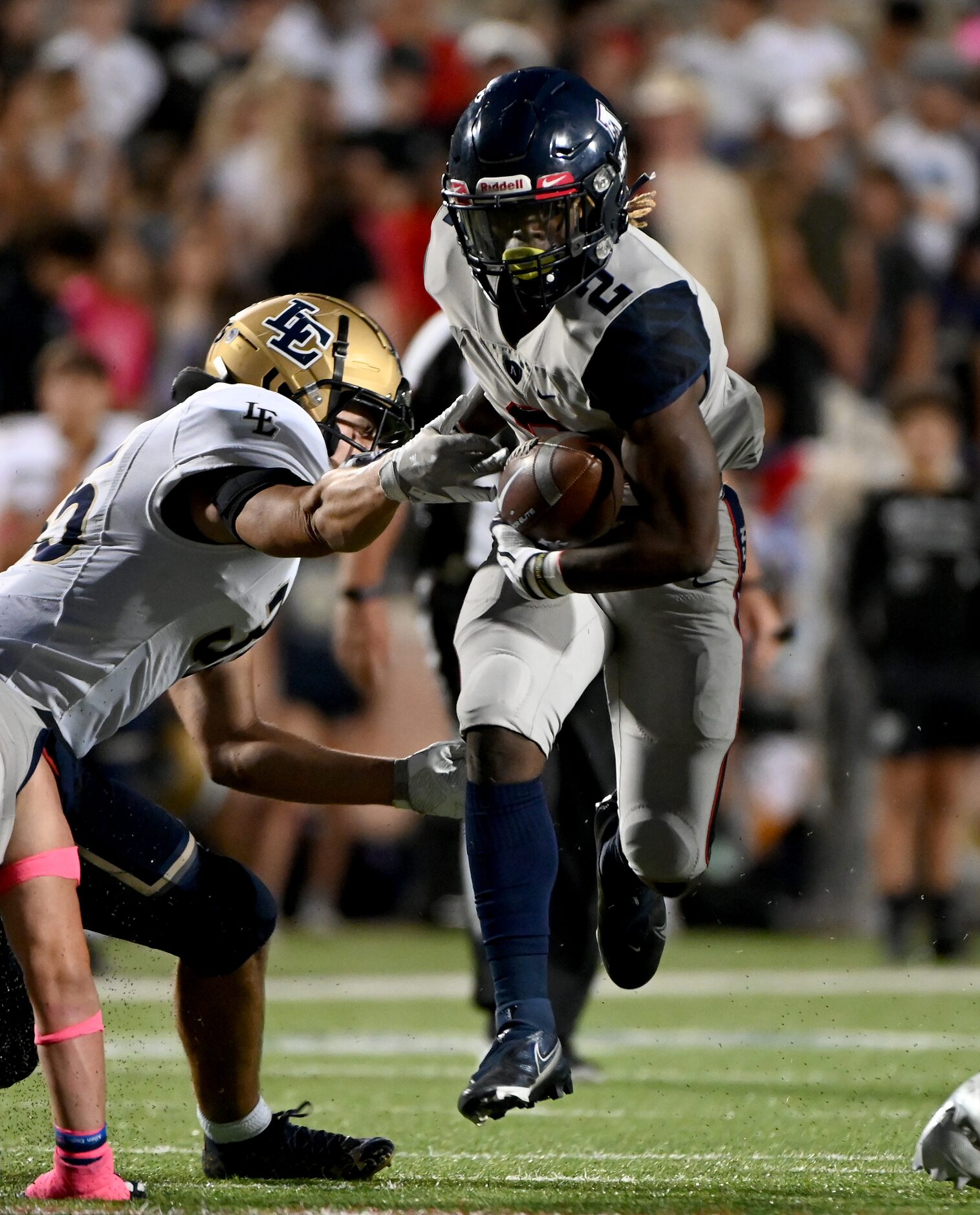 Allen’s Jaylen Jenkins (2) runs through a tackle attempt by Little Elm’s Tyson Bope (35) in...