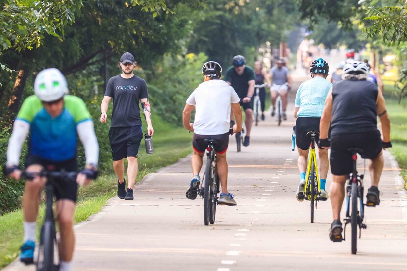 The swarm of people walking and riding bikes at White Rock Lake in Dallas on Wednesday...