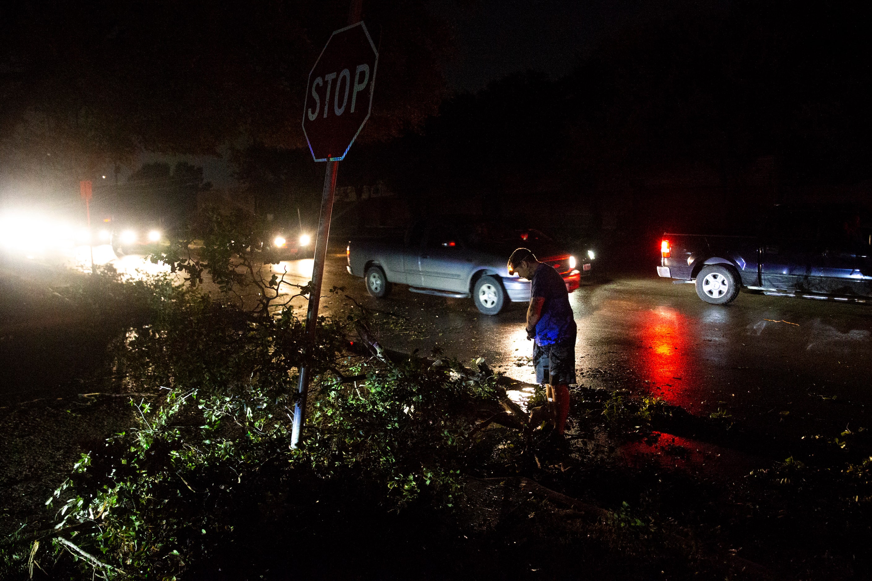 Mark Jennings inspects sustained damage at his home near Thomas Jefferson High School after...