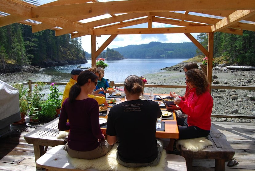 

Guests of Go With the Flow enjoy a meal with the owners overlooking Maurelle Island’s...