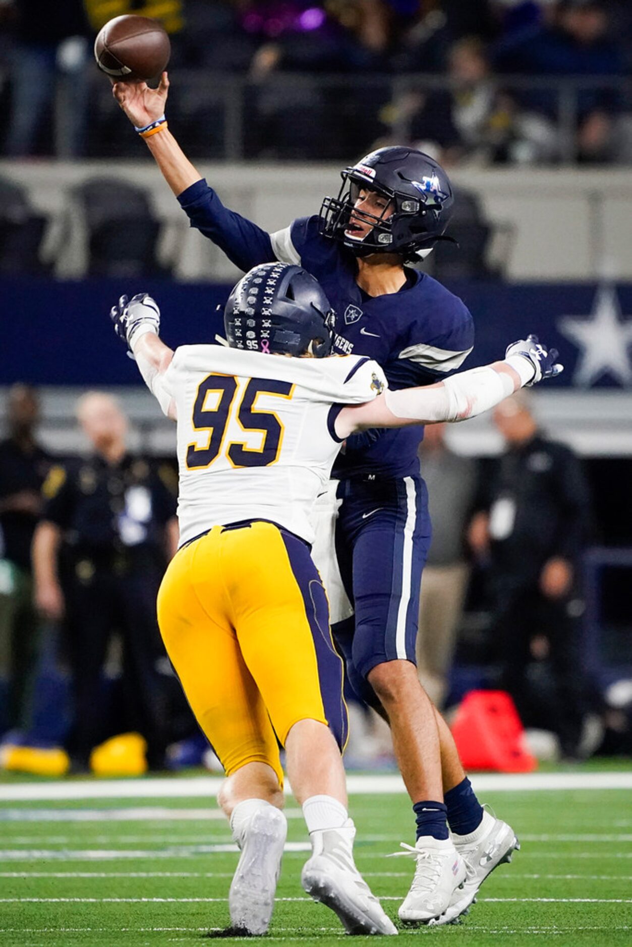 Frisco Lone Star wide quarterback Garret Rangel throws a pass under pressure from Highland...