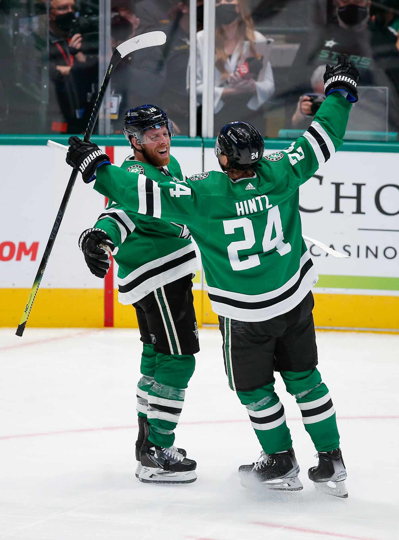 Dallas Stars forward Joe Pavelski, left, is congratulated by forward Roope Hintz (24) after...