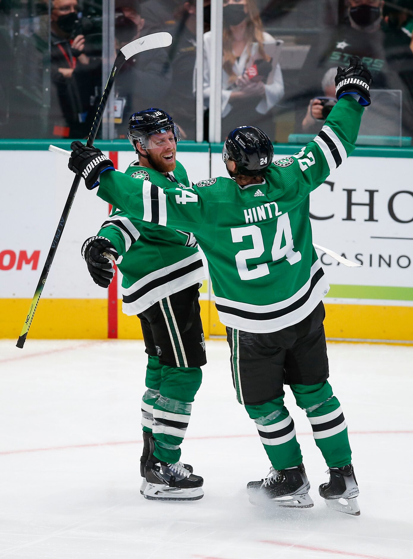 Dallas Stars forward Joe Pavelski, left, is congratulated by forward Roope Hintz (24) after...