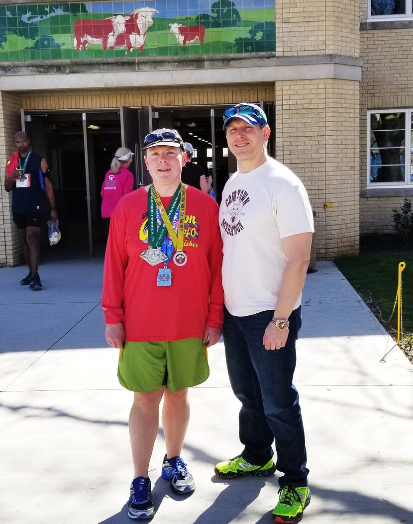 Corey Hlavacek, left, with his brother, Ryan Hlavacek of Plainfield, IL, at the finish of...