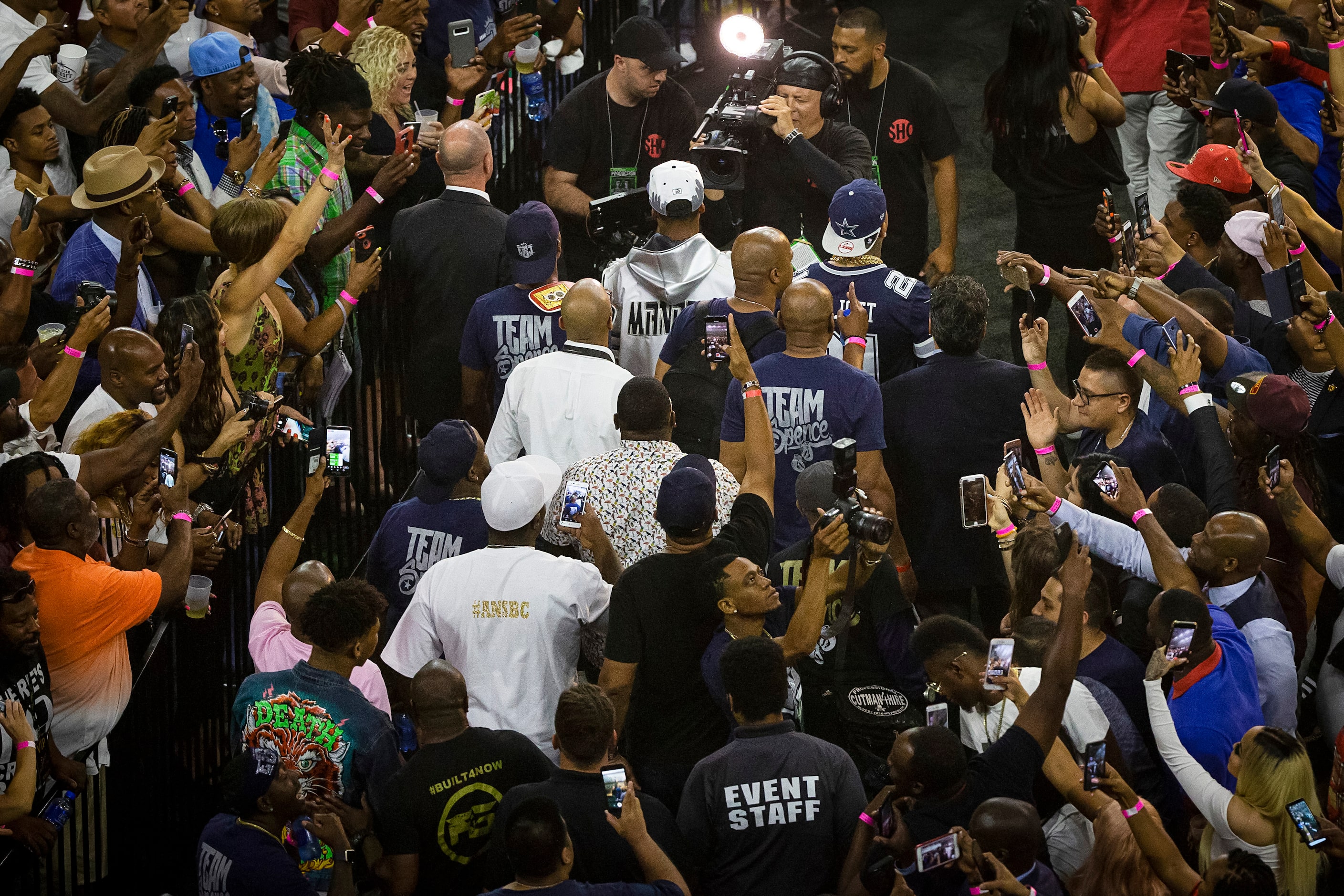 Fans cheer as welterweight champion Errol Spence Jr. enters the ring to defend his IBF world...