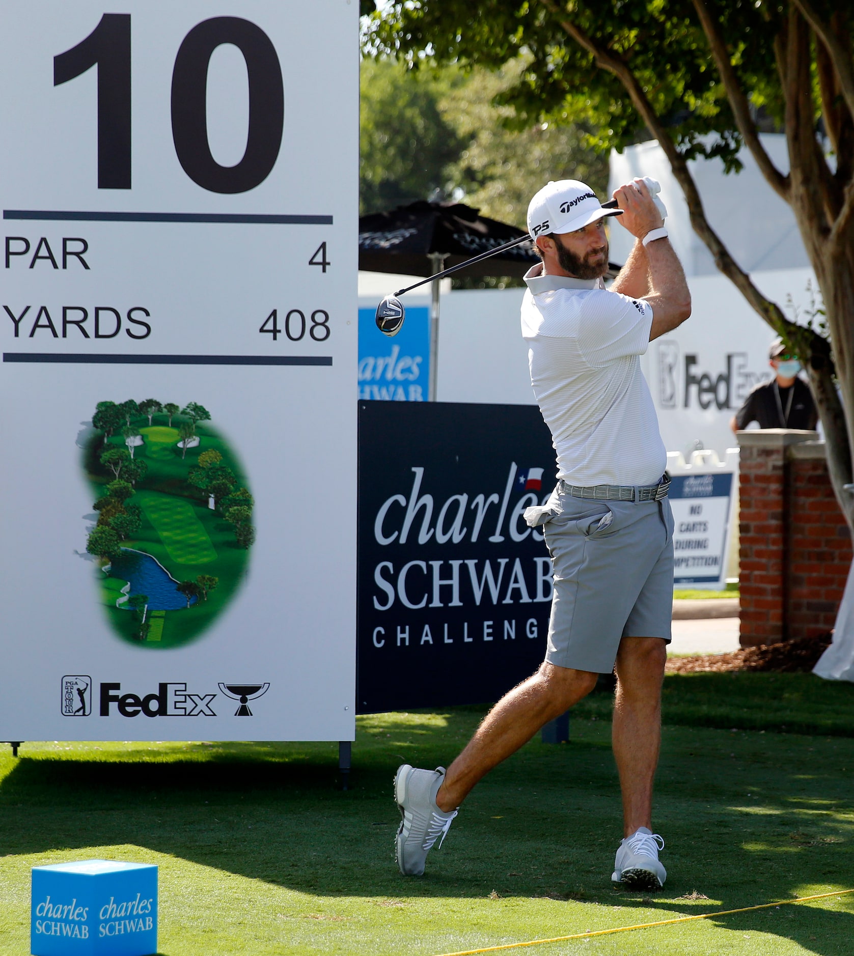 PGA golfer Dustin Johnson tees off on No. 10 during the Charles Schwab Challenge practice...