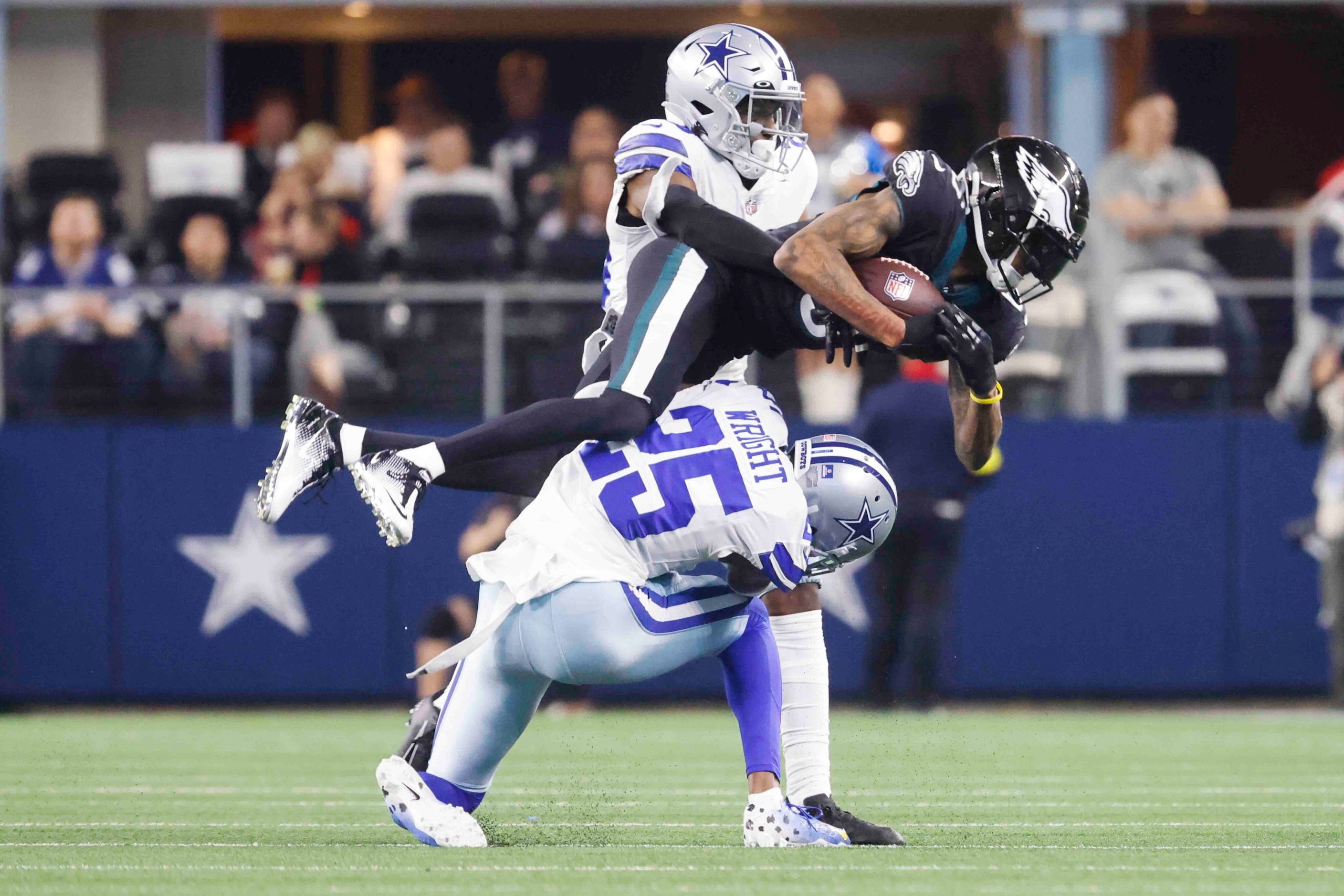 Philadelphia Eagles wide receiver DeVonta Smith (6), center, receives a pass past Dallas...