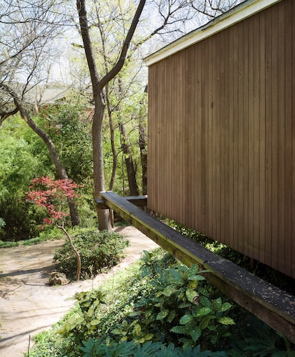 Steel beams support the bedroom wing, shown in 2008, which cantilevers out over the...