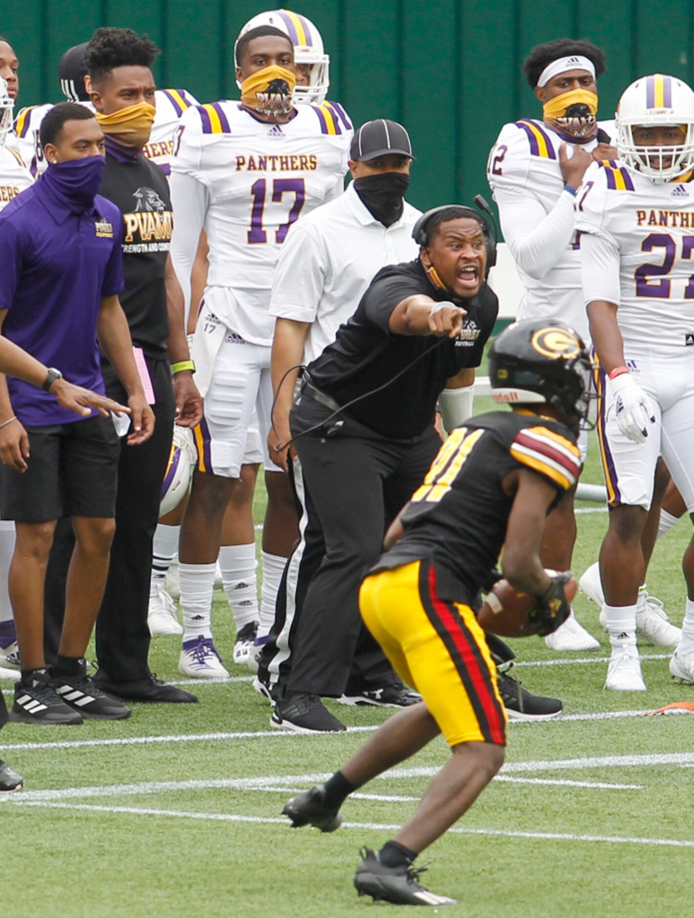 Prairie View A&M assistant defensive coach Ryan Burton vehemently tries to tip Panthers...