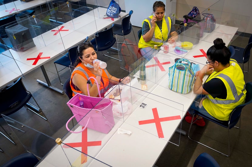 Flex-N-Gate limits seating in its break room and uses clear plastic barriers so workers can...