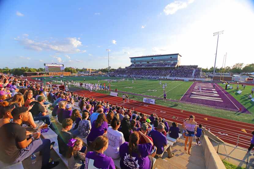 Fans in attendance look on during a football game at Tarleton State's Memorial Stadium.