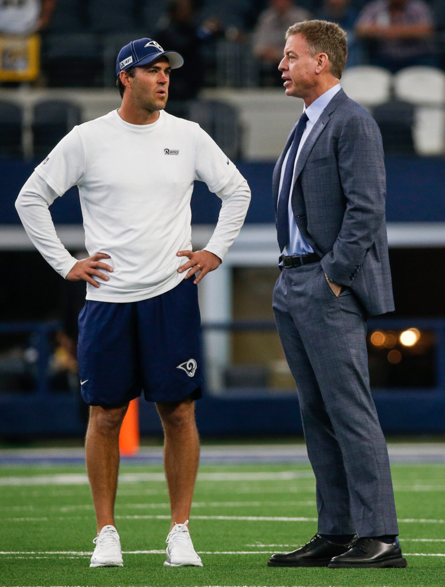 Troy Aikman talks to people on the field prior to an NFL matchup between the Dallas Cowboys...