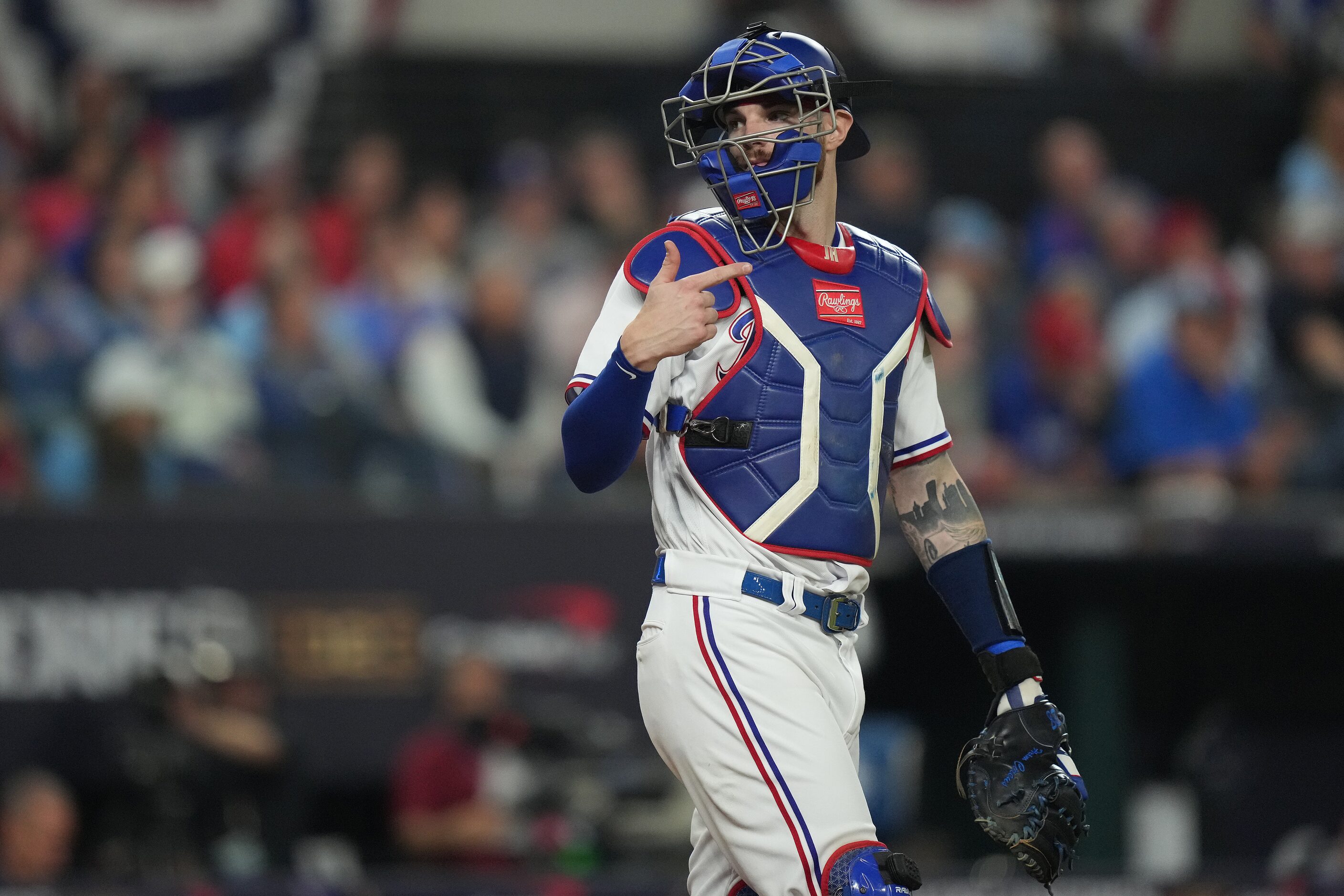 Texas Rangers catcher Jonah Heim makes a mound visit during the eighth inning in Game 2 of...