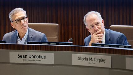 DFW International Airport board chair Henry Borbolla III (left) and CEO Sean Donohue listen...