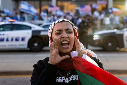 Hibah Abudaabes led chants with hundreds of fellow demonstrators attending the Palestinian...