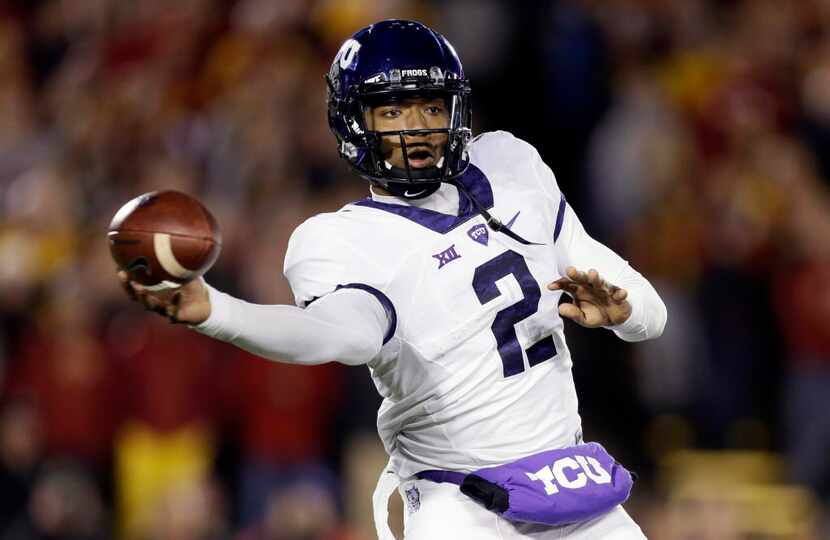 TCU quarterback Trevone Boykin throws a pass during the first half of an NCAA college...