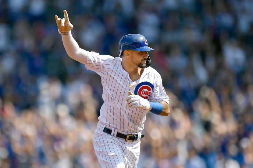 FILE - Chicago Cubs' Nicholas Castellanos celebrates while rounding the bases after Kris...