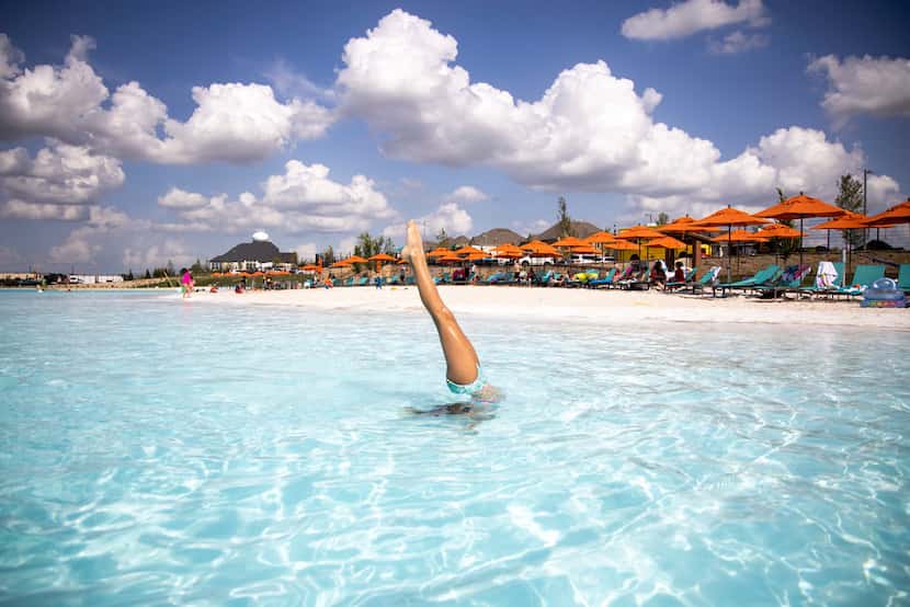 Alexis Domin performs a handstand in the water at the Crystal Lagoon.