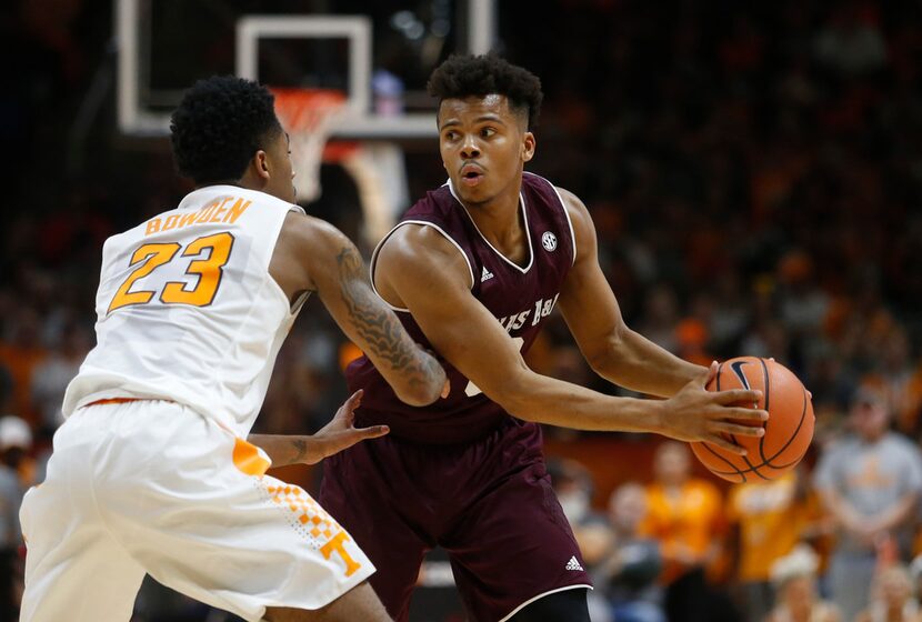 Texas A&M guard Admon Gilder (3) is defended by Tennessee guard Jordan Bowden (23) during...