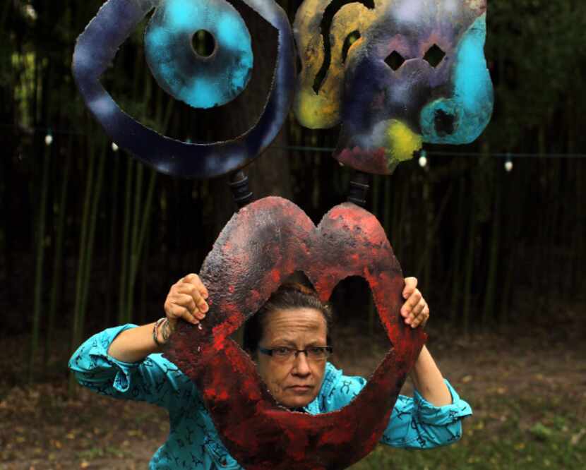 "See No Evil" is of the metal sculptures that grace the back yard of artist Cynthia Daniel's...
