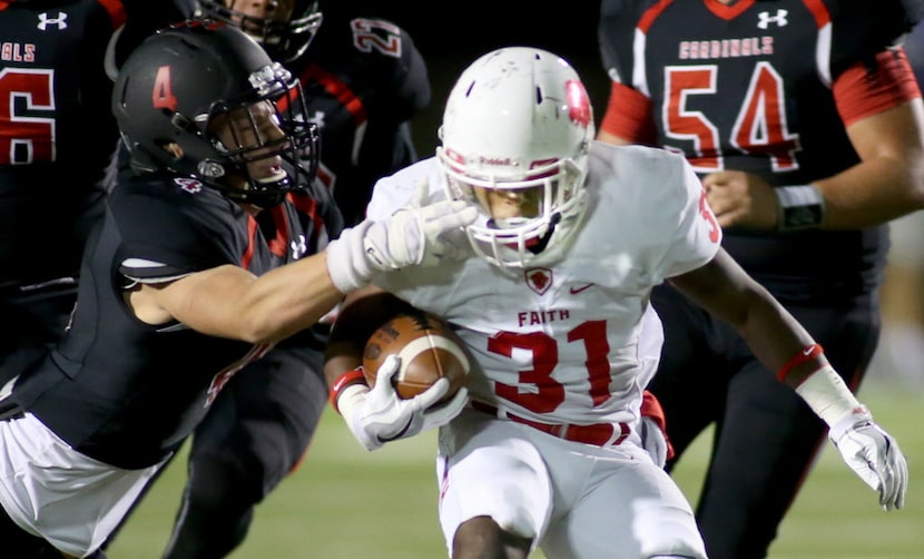 Fort Worth Christians Cade Cruzzen (4) grabs the face mask of Grapevine Faith's Keyshawn...