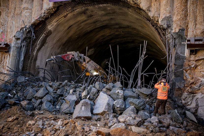 Workers break through the end of a tunnel for Maryland's Purple Line, which is already...