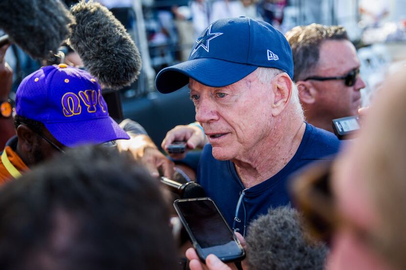 Dallas Cowboys owner Jerry Jones answers questions from reporters during an afternoon...