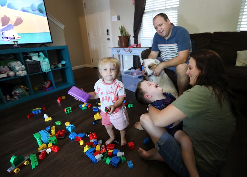 1-year-old Laney Clausi, left, 3-year-old Dallin Clausi, Dave Clausi, and Christina Clausi...