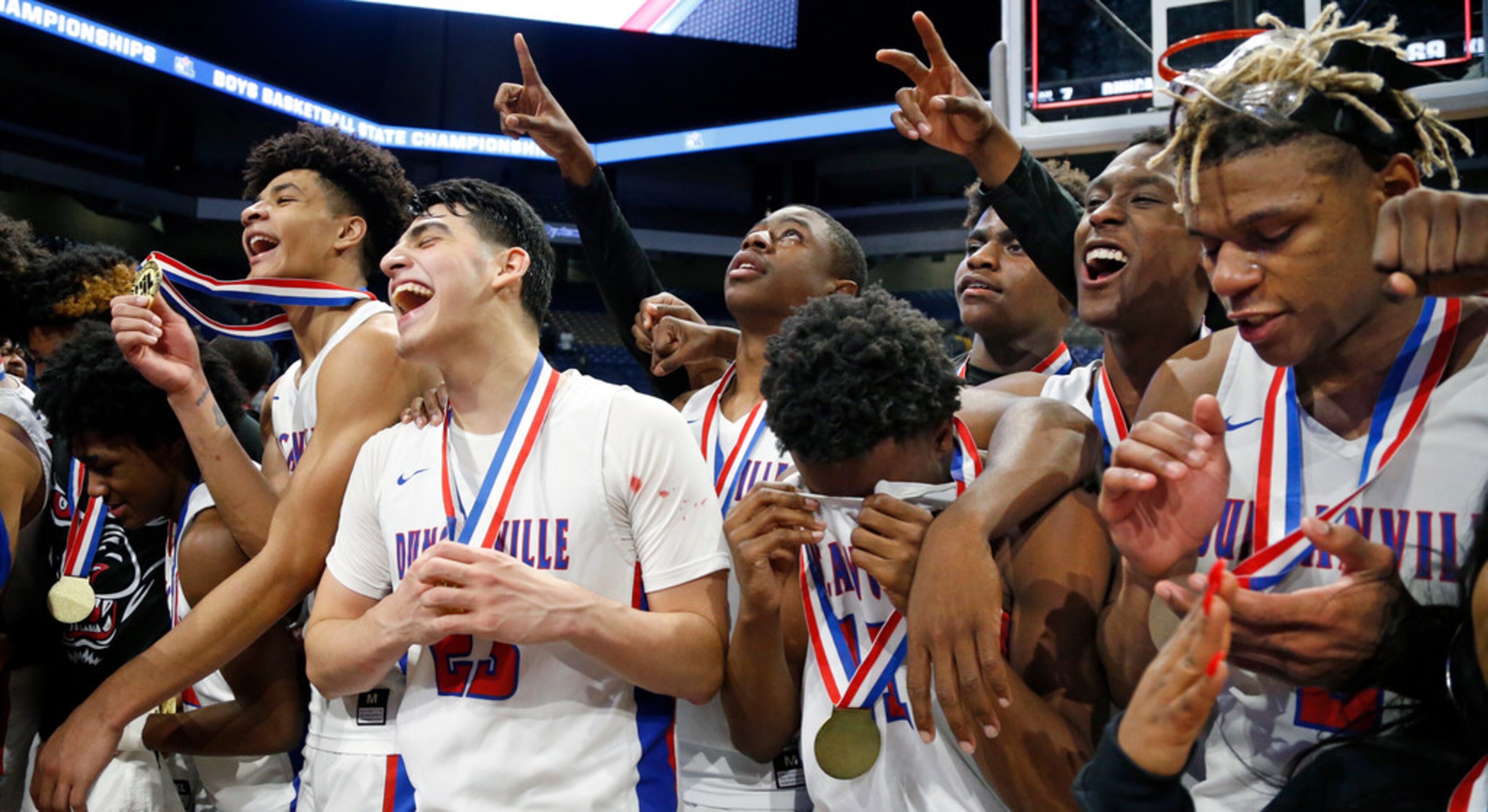 Duncanville celebrates following a UIL boys basketball 6A State Final between Duncanville...