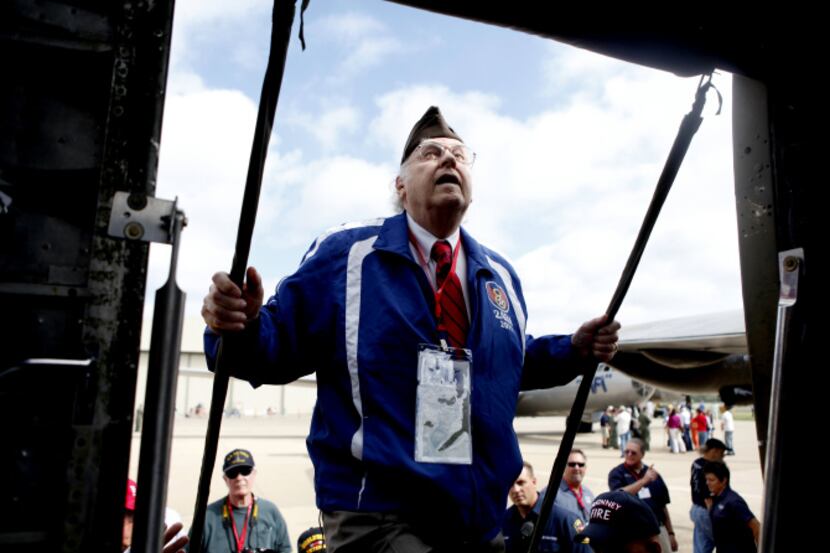 Lee Swofford boards the B-27 aircraft during the McKinney Air Show on October 3, 2013 at the...