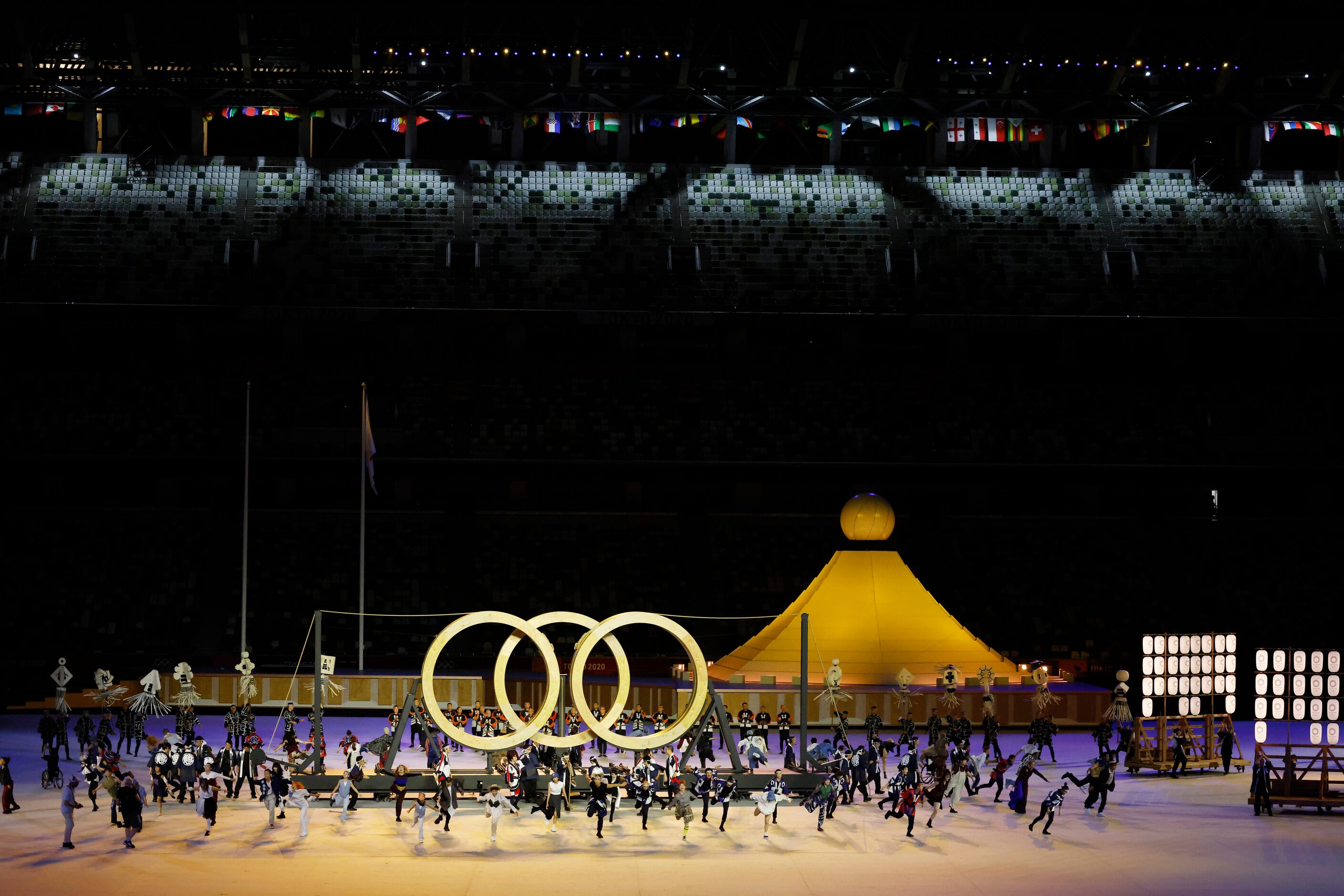 Entertainers perform during the opening ceremony for the postponed 2020 Tokyo Olympics at...