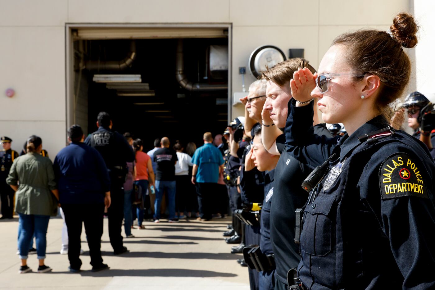Dallas police officers and family members of Jacob Arellano  pay their respect as Arellano’s...