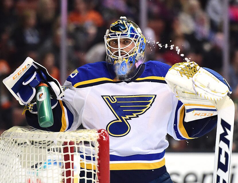 ANAHEIM, CA - JANUARY 15: Carter Hutton #40 of the St. Louis Blues has some water during a...