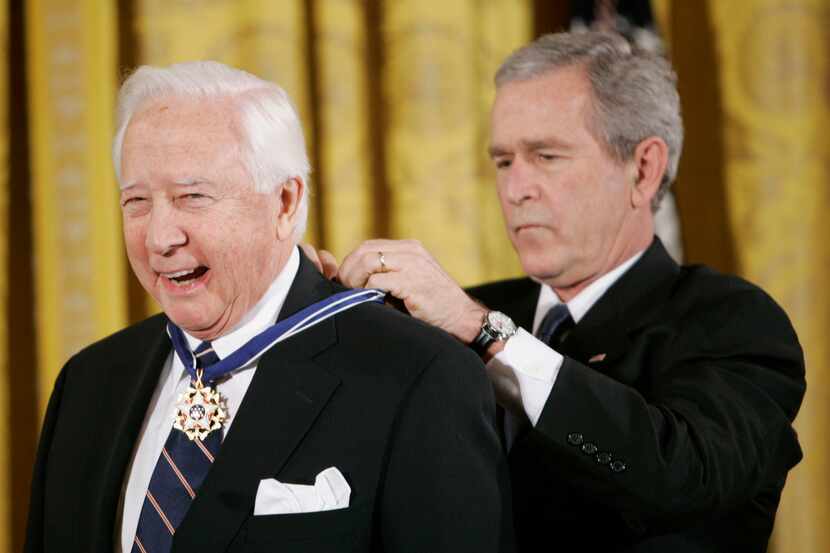 President George W. Bush bestows the Presidential Medal of Freedom to author and historian...
