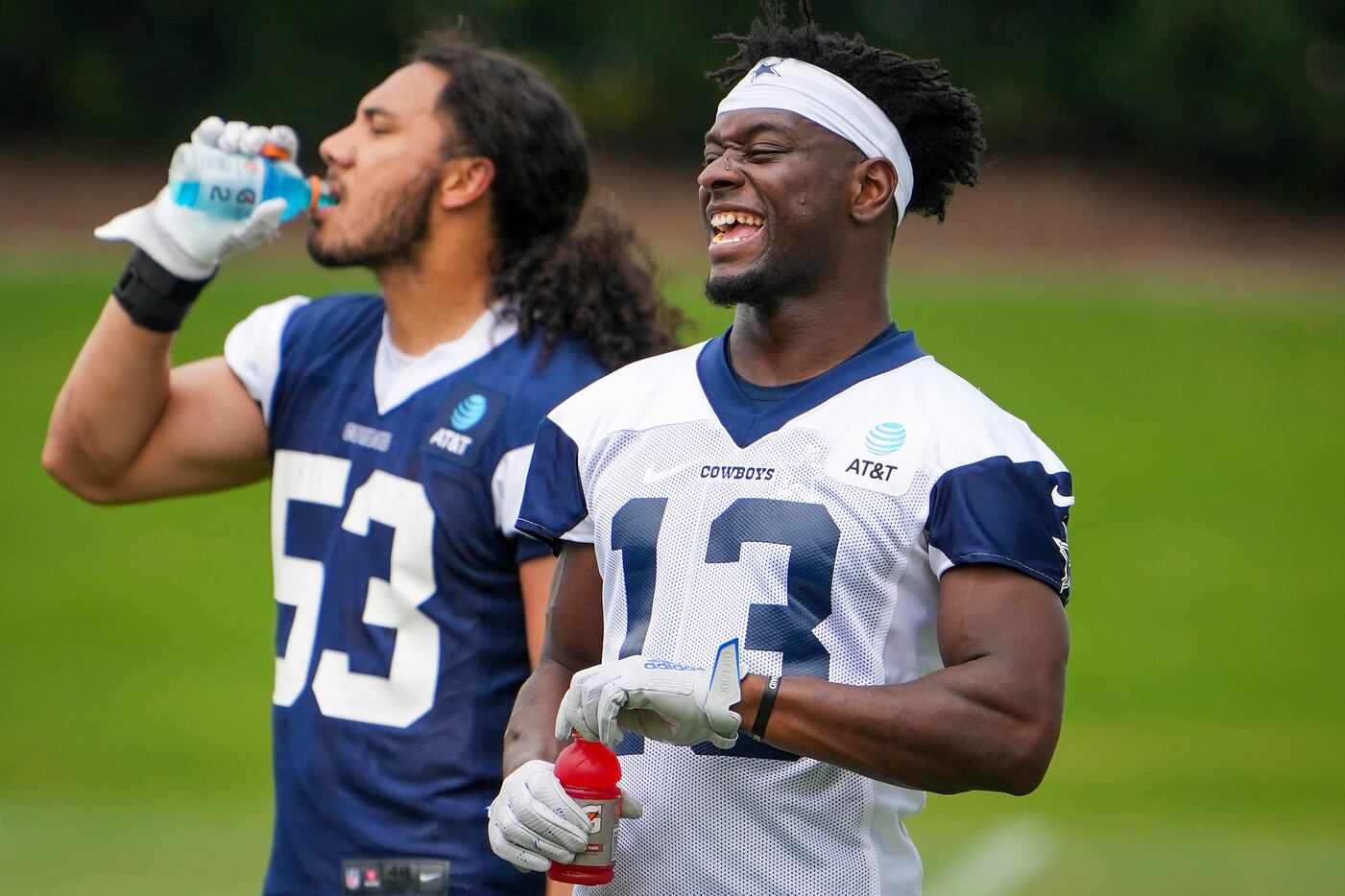 Dallas Cowboys wide receiver Michael Gallup (13) laughs while pausing for a Gatorade break...