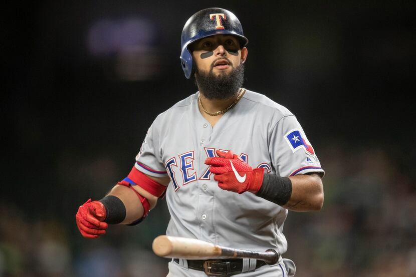 Texas Rangers' Rougned Odor flips his bat after striking out to Seattle Mariners relief...