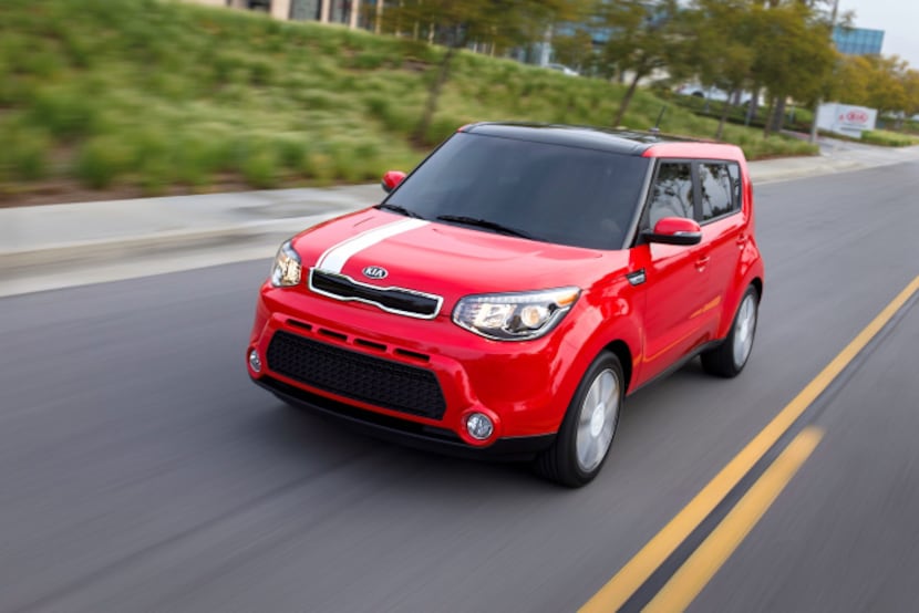 The 2014 Kia Soul features large, swept-back headlamps, a short, flat hood and a big...
