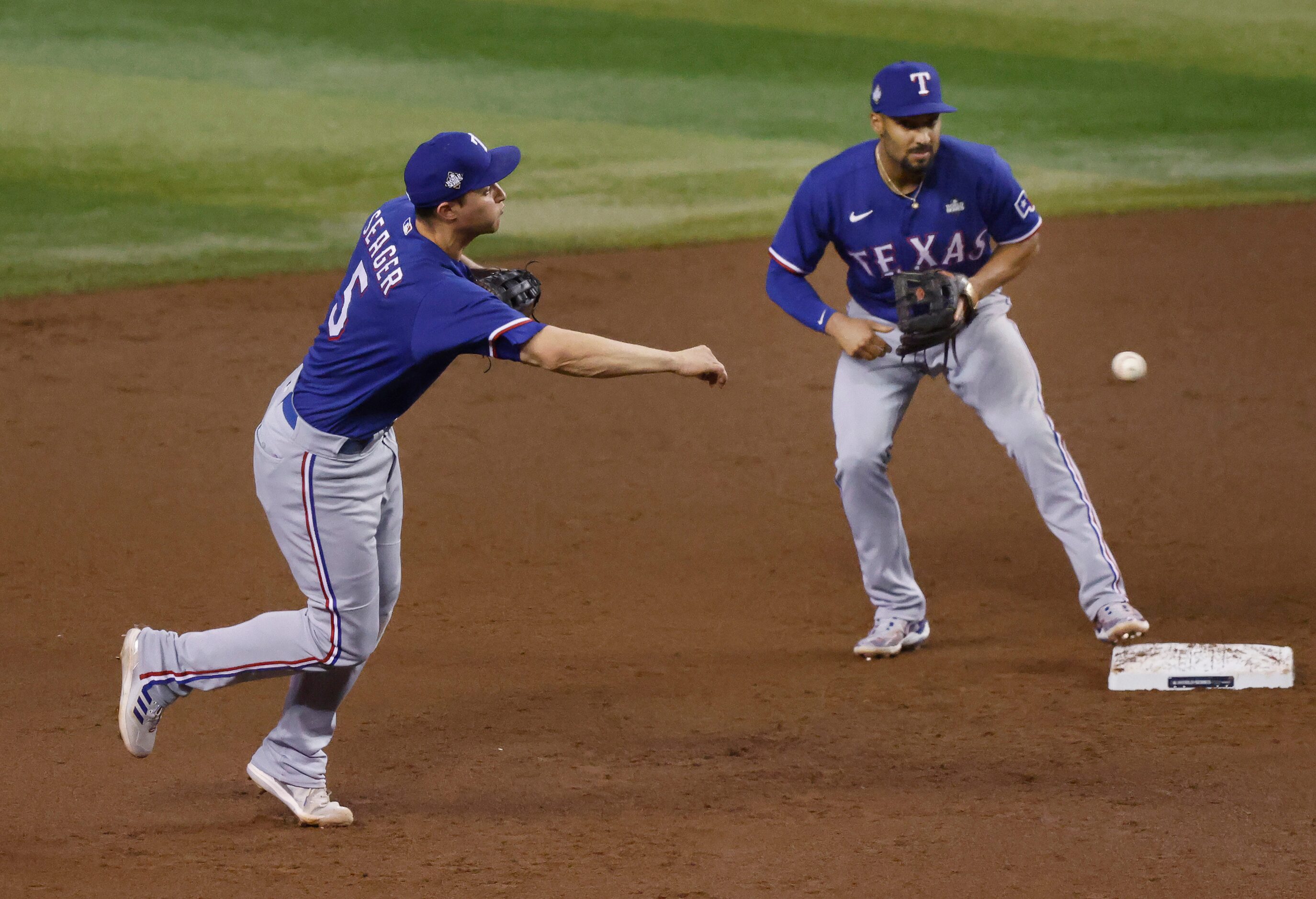 Texas Rangers shortstop Corey Seager (5) throws out Arizona Diamondbacks batter Lourdes...