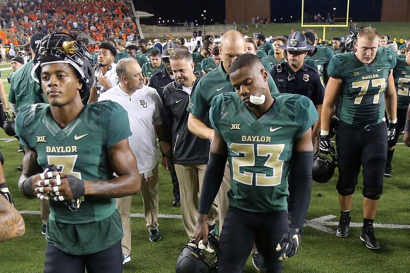 Baylor players walk off the field following a 17-10 loss to UTSA in an NCAA college football...