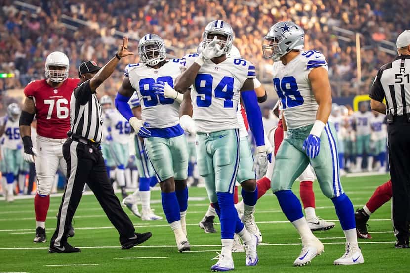 FILE - Cowboys defensive end Randy Gregory (94) celebrates with defensive end Tyrone...
