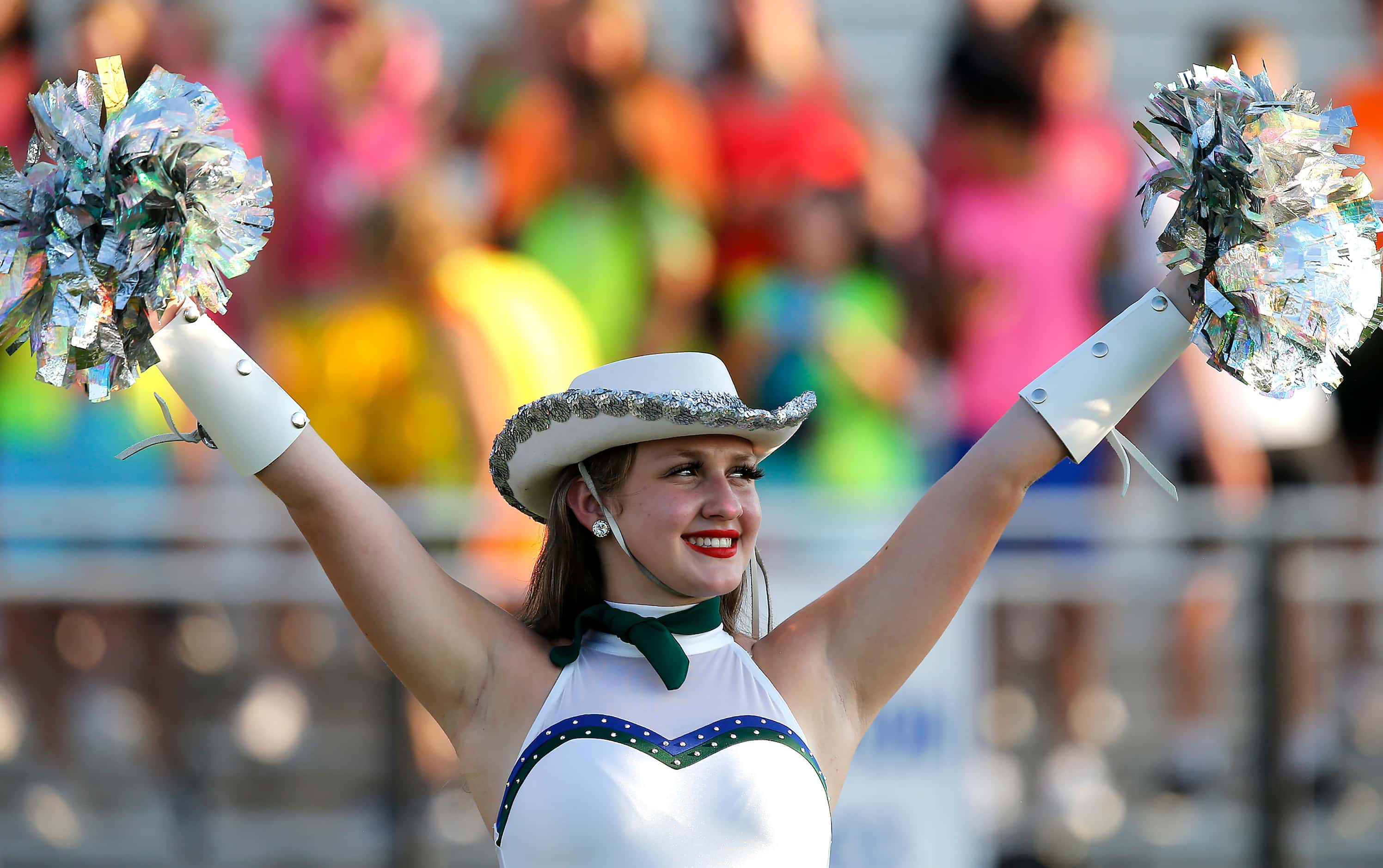 Olivia Henry, 17, with the Reedy High School Saphires, performs before kickoff as Reedy High...