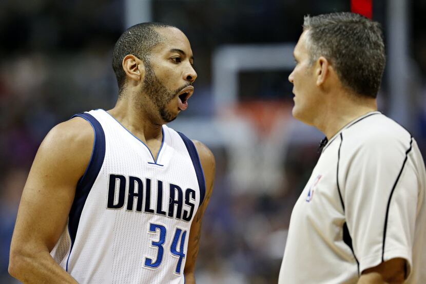 Dallas Mavericks guard Devin Harris argues with an official during the first half against...