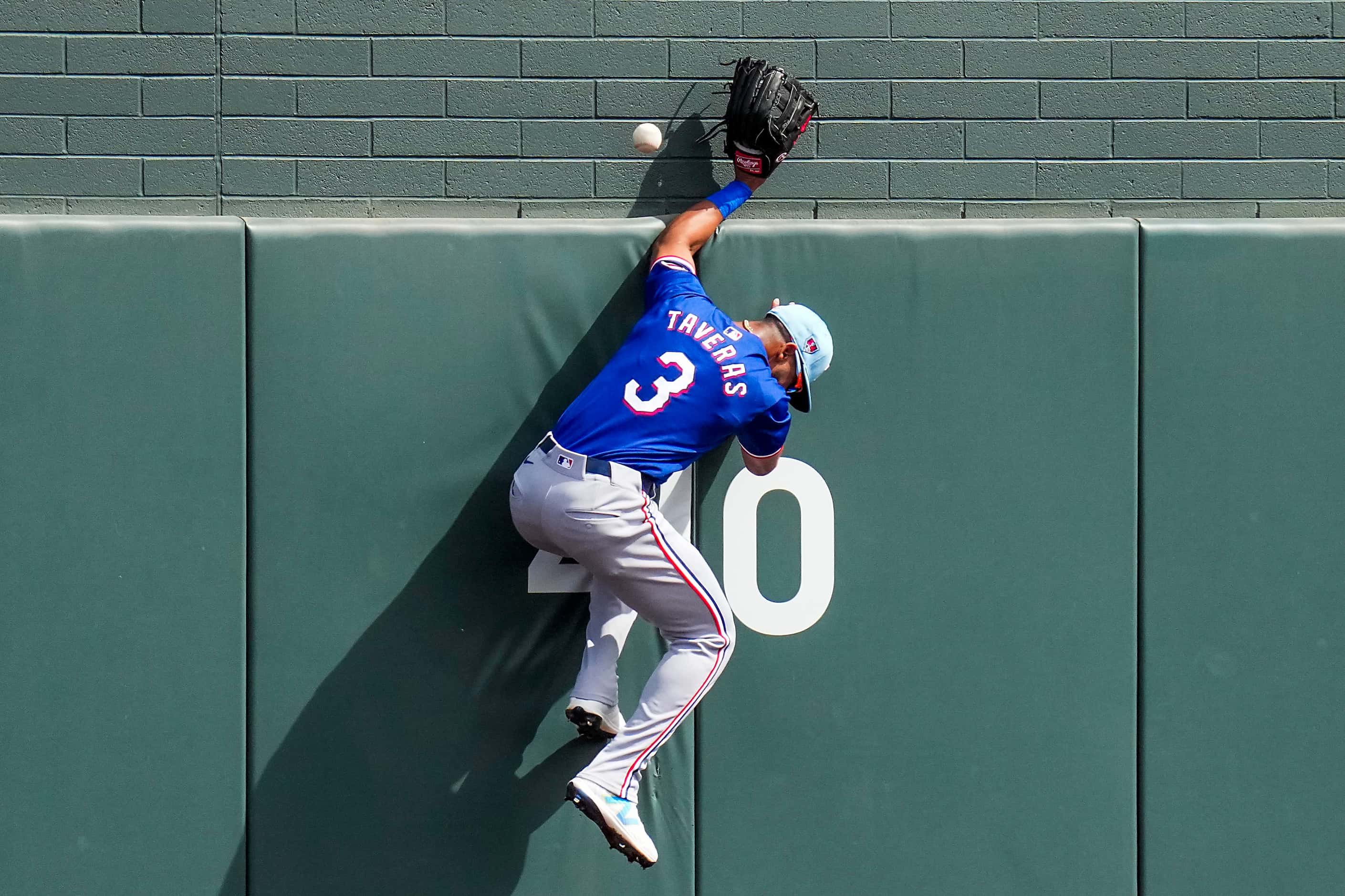 Texas Rangers center fielder Leody Taveras can’t make a leaping play on triple off the bat...