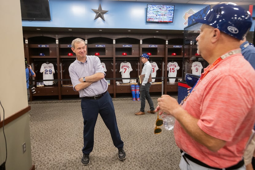 John Blake, Executive Vice President, Public Affairs for the Texas Rangers, chats with...