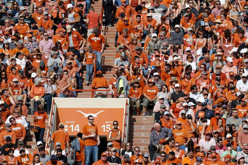 Texas Longhorns fans cheer against West Virginia Mountaineers in the second half at Darrell...