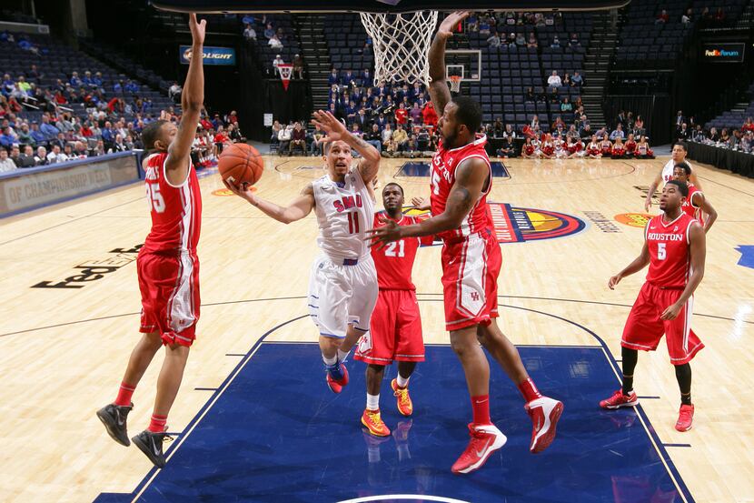 MEMPHIS, TN - MARCH 13: Nic Moore #11 of the SMU Mustangs drives to the basket for a layup...