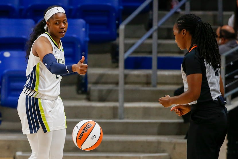 Dallas Wings guard Arike Ogunbowale (24) motions to the referee after a called foul during...