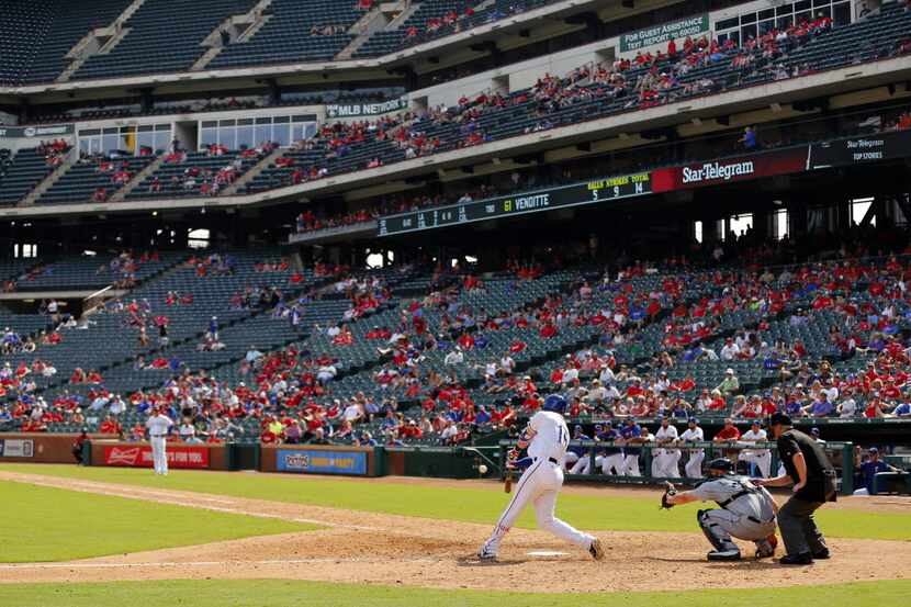 Texas Rangers left fielder Ryan Rua (16) hits an eighth inning solo home run against the...